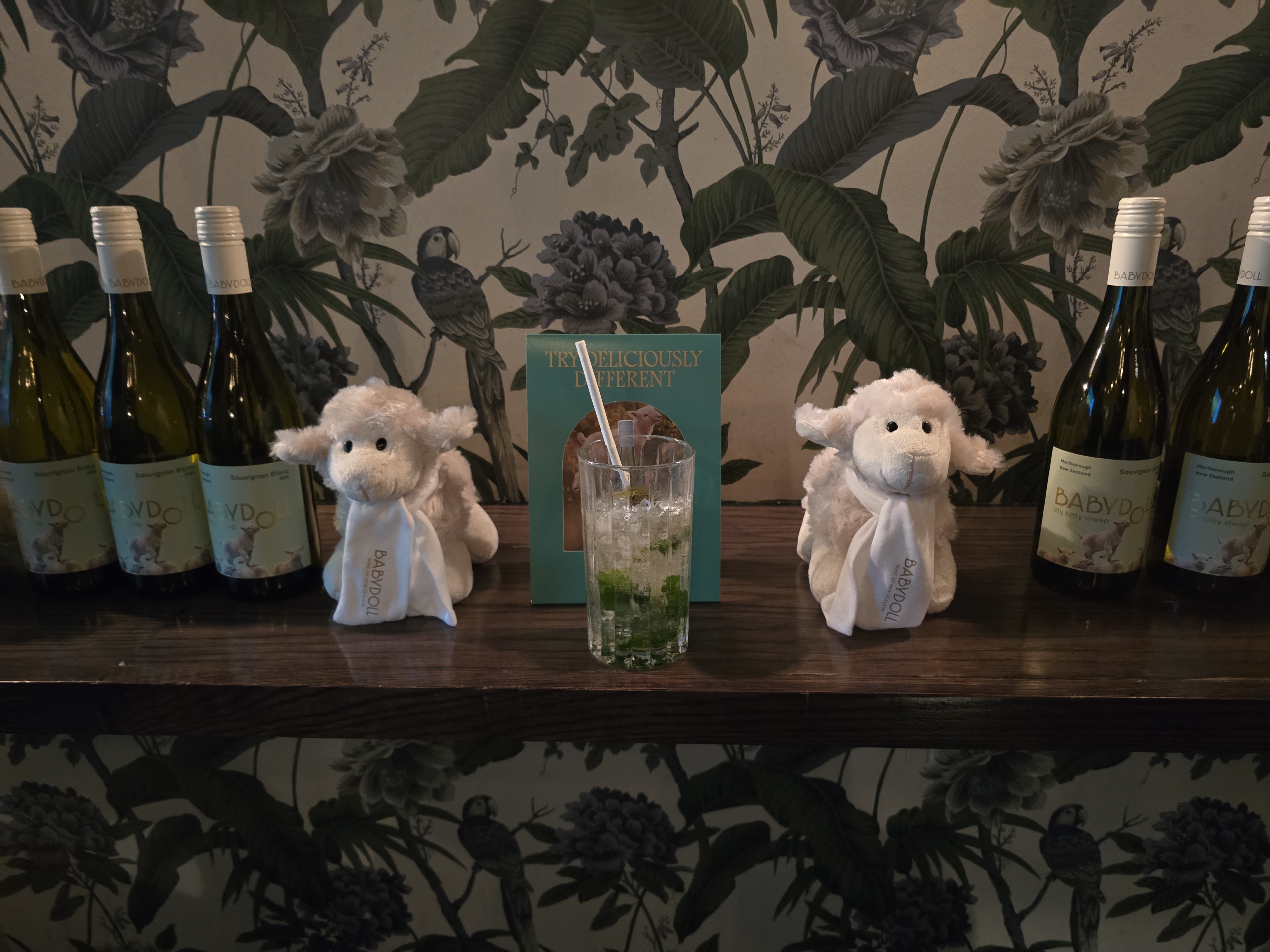 Bottles of Yealands Babydoll Sauvignon Blanc, a Babydoll Spritz & some cuddly sheep!